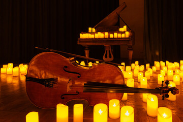 closeup of violin with lots of candles