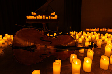 closeup of violin with lots of candles