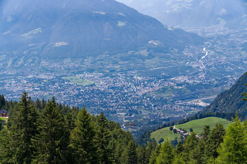 Aerial view of Italian City of Meran with Etsch Valley and Etsch River seen from mountain resort...