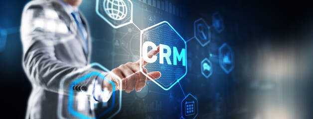 Customer relationship management system concept. Businessman touching finger CRM