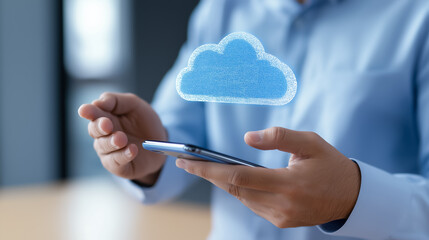 Close-up of a man using a smartphone, interacting with a floating digital cloud symbol, indicating cloud technology.