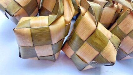 Ketupat wrapped in coconut leaves
