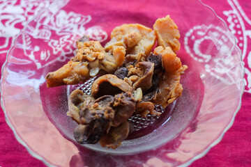 fried chicken side dish and chicken gizzards in a glass plate