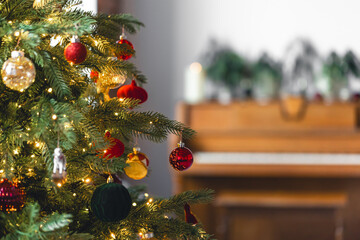 Christmas background with decorated Christmas tree and piano, copy space.