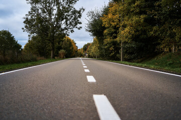 Fototapeta premium landscapes of an autumnal European village, Belgium, leaves colored by fall