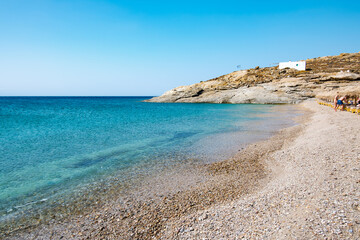 Lia Beach, wild and free beach in the south of Mykonos, Greece. Pristine bay with blue sea and crystal water, famous for naturism and Scuba diving school, peaceful and quiet.