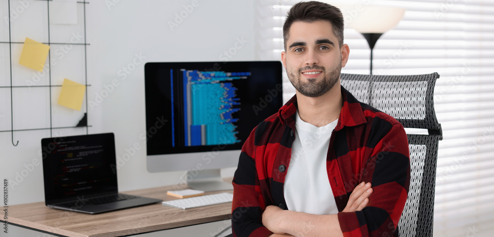 Poster programmer working at desk in office. banner design