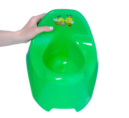 Green baby potty in hand isolation