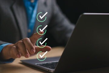 Digital document management system and business performance checklist concept,businessman using...