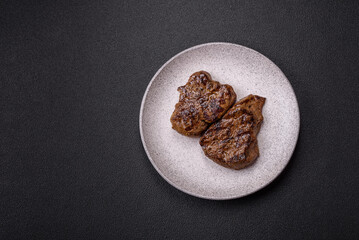 Juicy beef steak grilled with salt, spices and herbs