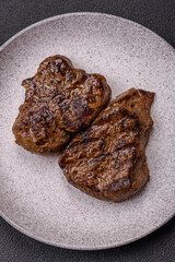 Juicy beef steak grilled with salt, spices and herbs