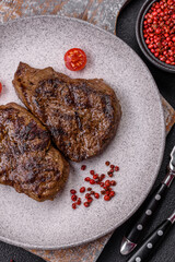 Juicy beef steak grilled with salt, spices and herbs