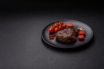 Juicy beef steak grilled with salt, spices and herbs