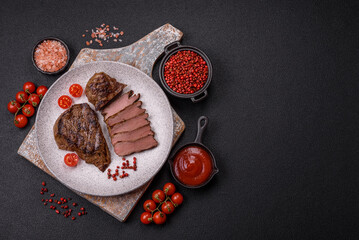 Juicy beef steak grilled with salt, spices and herbs