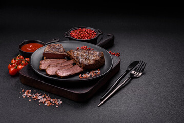 Juicy beef steak grilled with salt, spices and herbs
