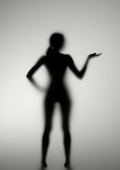 Silhouette of a girl behind opaline glass