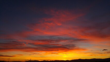 reddish sunset red and black clouds madrid sierra