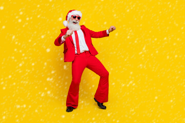 Full length photo of good mood santa dressed red suit tie dancing discotheque having fun empty space isolated yellow color background