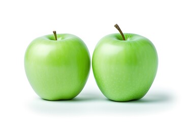 Composition with whole and cutted green apples isolated on a white background.