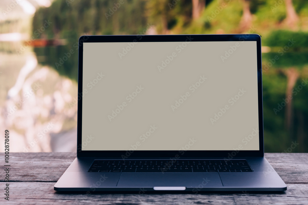 Aufkleber open laptop on wooden table workspace with pure nature on background.computer with copy space screen