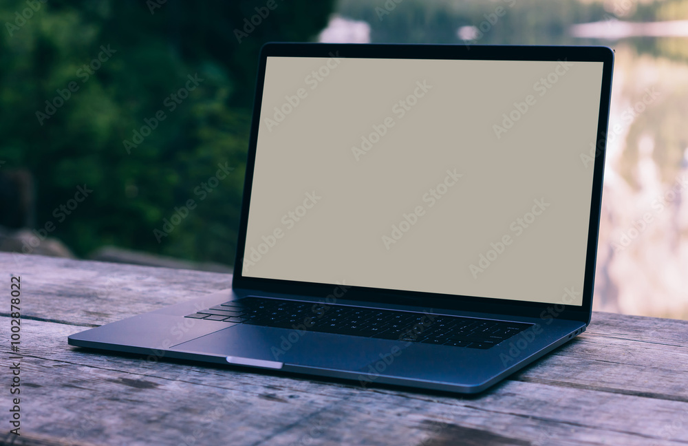 Aufkleber open laptop on wooden table workspace with pure nature on background.computer with copy space screen