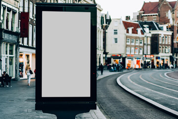 Clear Billboard on city street with blank copy space screen for advertising or promotional poster content, empty mock up Lightbox for information in Amsterdam, blank display outdoors in urban area © BullRun