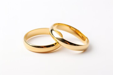 Wedding gold rings isolated on white.