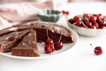 Tasty cherry pie on white table. Summer food concept. Soft focus