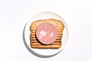 toast with sausage on a white background
