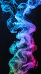 Fototapeta premium A vibrant swirl of colorful smoke against a dark background, creating an abstract visual effect.