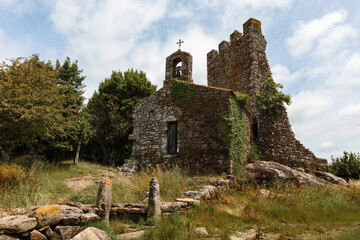 Ancient stone church in a natural setting.