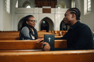 Priest listening to woman talking about problems in church