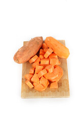 sweet potatoes cut on a wooden board  