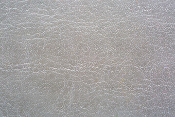 Gray macro synthetic leather,Natural, genuine gray leather texture close up, macro. Structure of glossy leatherette, artifical skin surface with embossing pattern. Background, wallpaper