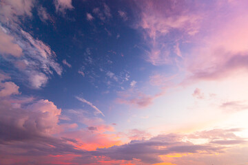 Orange and pink sky and clouds background. Colorful sky concept background. Beautiful sunset with dusk sky and clouds,Colorful clouds and sky,Dusk, Sunset Sky Clouds in the Evening with colorful Orang