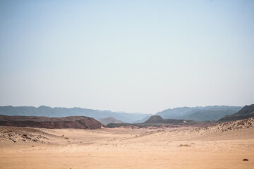Image of the desert and mountains on the Sinai Peninsula at sunset. The Sinai Desert is an attraction accessible to vacationers of all resort areas of Charm. excursion in Egypt.