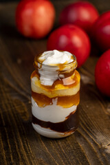 natural yogurt in a glass jar with fruits