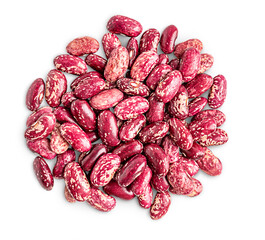 Top view of handful heap of red dried vegetarian uncooked organic pinto beans isolated on white background used as ingredient in mexican cuisine as source of healthy protein and dietary fiber 