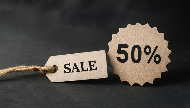 Sale tag with text 50% off on black background. For promoting discounts and shopping events.