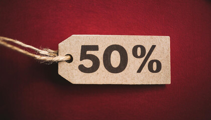 Sale tag with text 50% off on red background. For promoting discounts and shopping events.