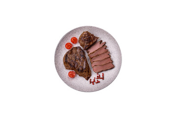 Juicy beef steak grilled with salt, spices and herbs