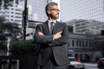 Businessman outdoor in the business city. Mature age adult Businessman outside. Hispanic business man. Business lifestyle. Businessman on the street. Business outdoor portrait of success Businessman.