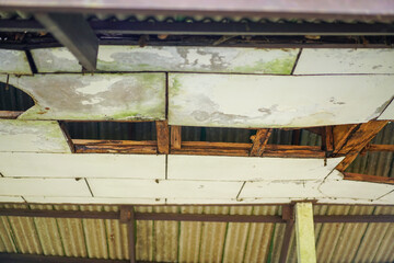 The damaged wooden roof structure of the pavilion. Home renovation or repair concept.