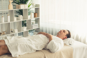 Caucasian man customer enjoying relaxing anti-stress spa massage and pampering with beauty skin...