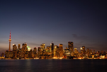 evening Toronto illuminated by lights panoramic photo from the water