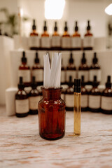 Glass brown bottle with white blotter paper for testing smell and mock up bottle with fragrance oil...