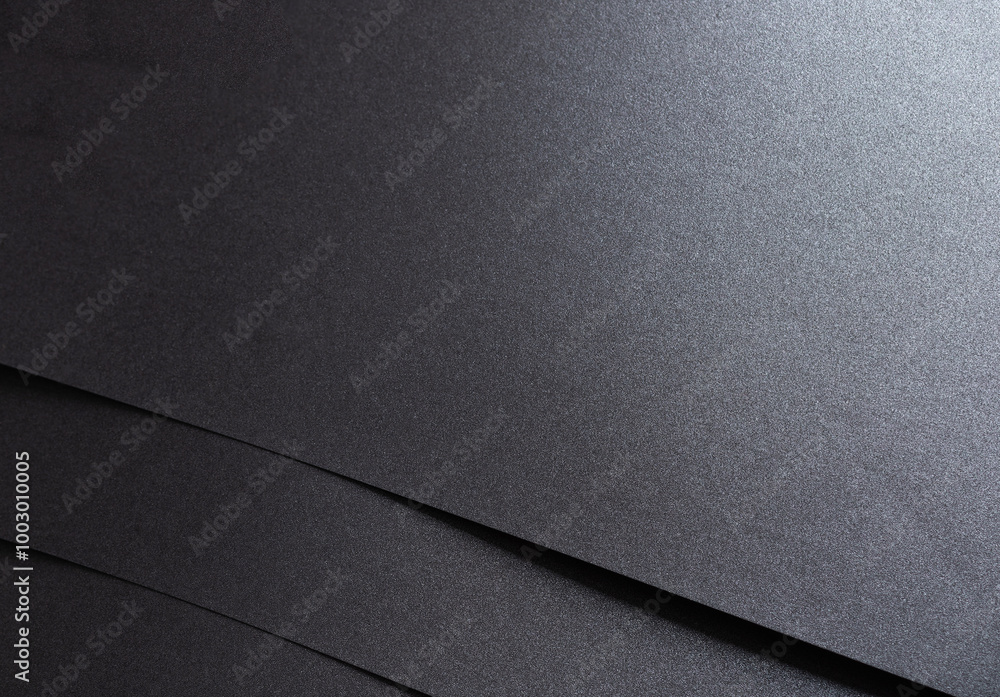 Aufkleber black paper with a smooth texture and minimalist, geometric pattern. the monochrome design features 