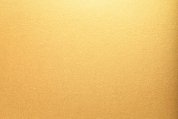 Gold paper with a smooth, glossy texture and bright, glowing gradient. The shining metallic surface...