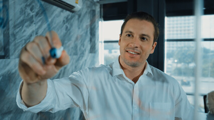 Portrait of professional male leader writing marketing idea on sticky notes. Caucasian businessman...