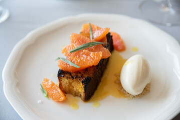 dessert, gourmet, restaurant, food, plate, cuisine, delicious, desserts, sweets, sweet, ice cream, citrus, orange, decadent, fruit, spoon, cream, milk, fresh, grapefruit, sponge cake, cake,